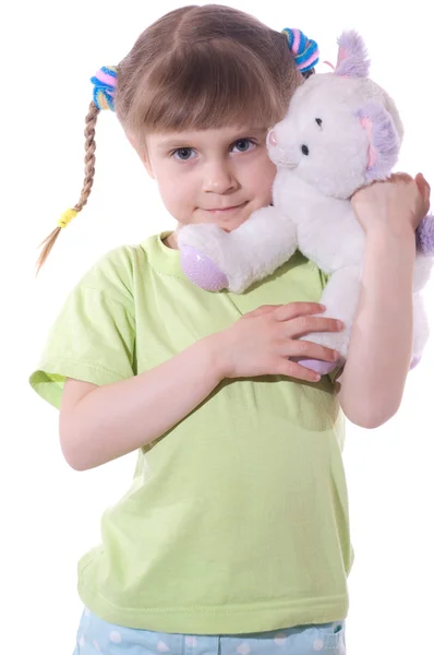 Girl with a toy kitten — Stock Photo, Image
