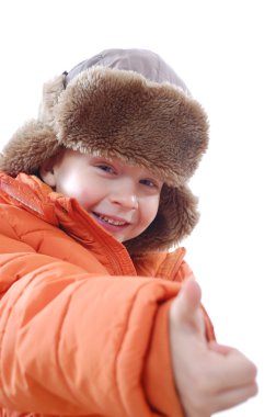 Happy child wearing winter clothing clipart