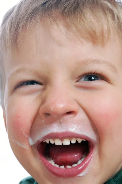 Szczęśliwe dziecko z twarzy mleczny — Zdjęcie stockowe