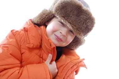 Lid wearing a coat and winter fur hat clipart