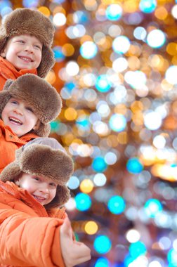 Winter kids with colorful lights clipart
