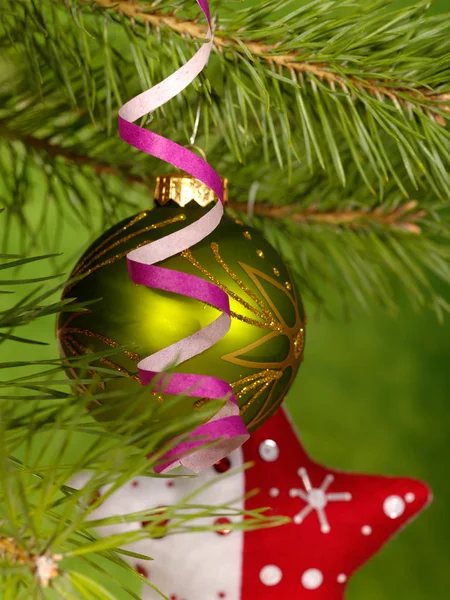 Xmas green ball on the green background. — Stock Photo, Image