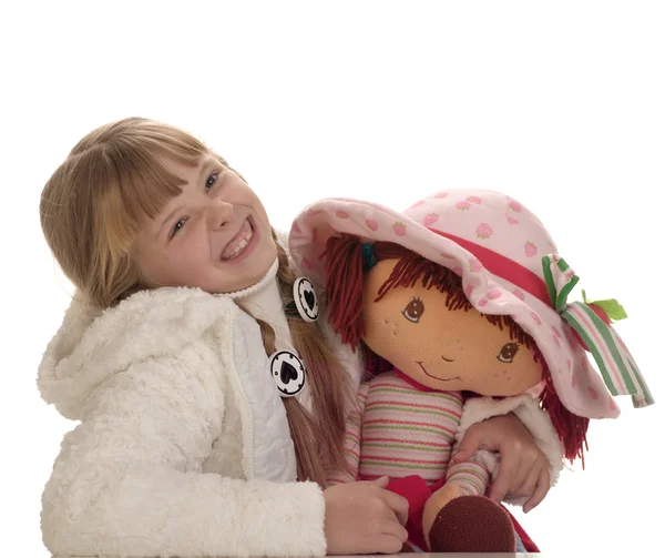 Ung vacker flicka med en docka — Stockfoto