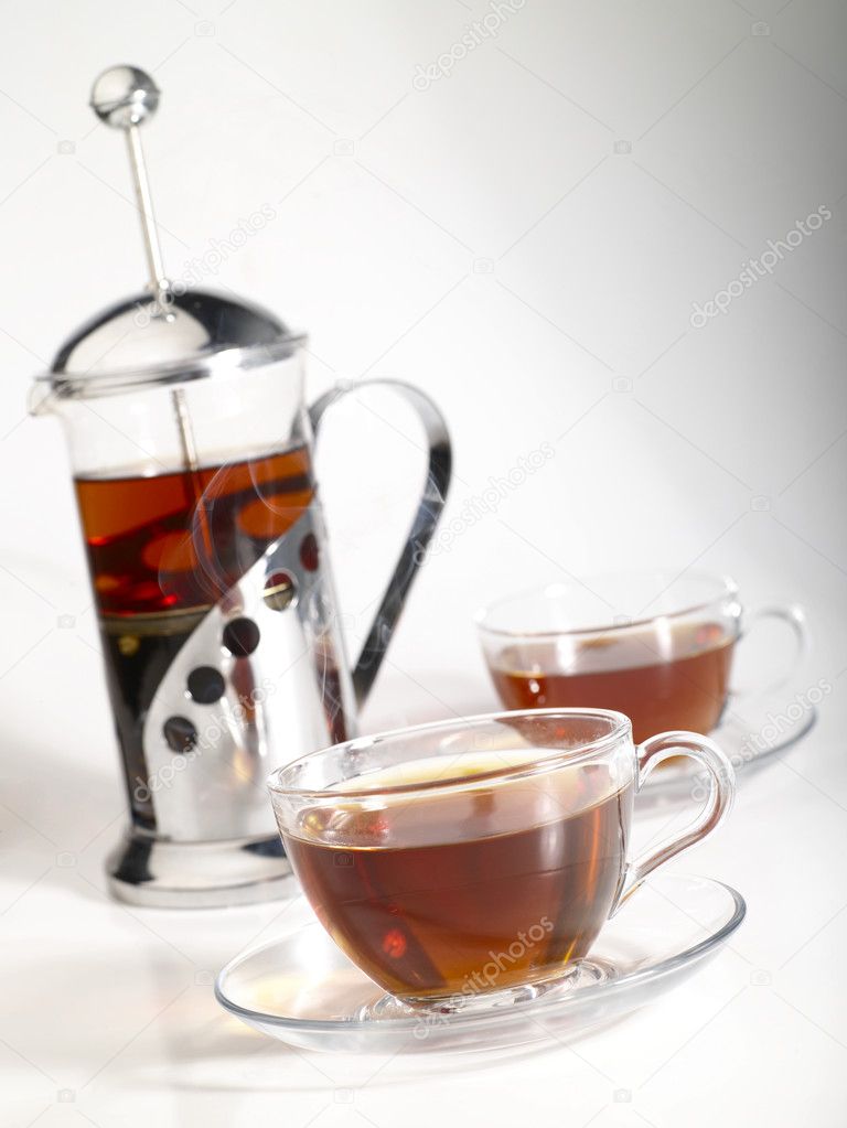 French-press withpair cups of tea and tr