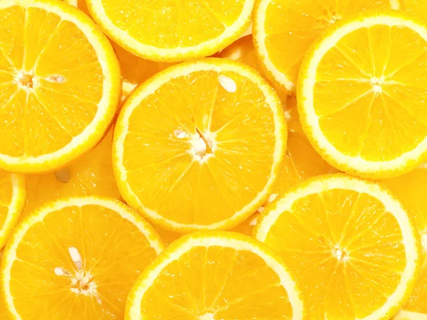 Verse smakelijke sinaasappelen als achtergrond op het — Stockfoto