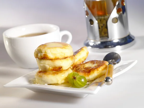 stock image Small delicious pancakes with tea and ho