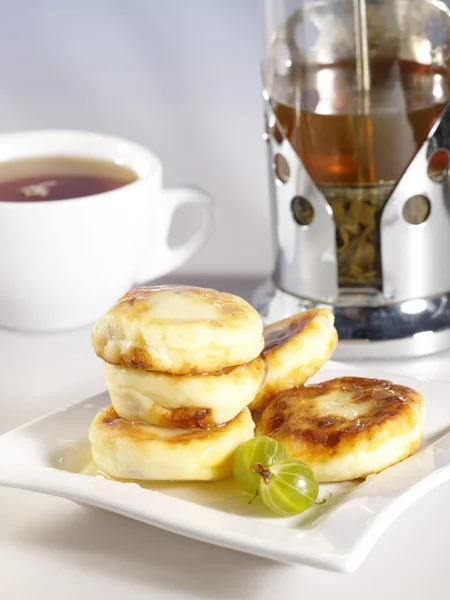 stock image Small delicious pancakes with tea and ho