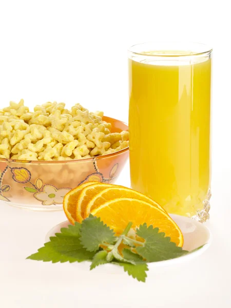 Orange juice with sliced fruit and corn — Stock Photo, Image