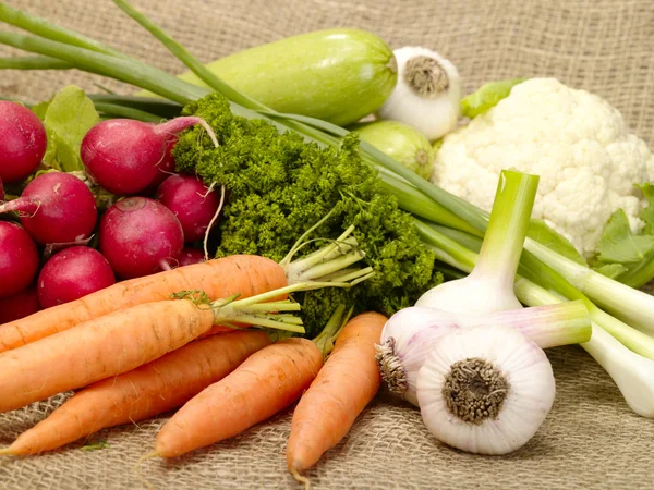 Fresh tasty vegetables on burlap — Stock Photo, Image