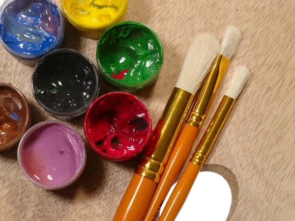Paintbrushes on palette. RGB concept — Stock Photo, Image