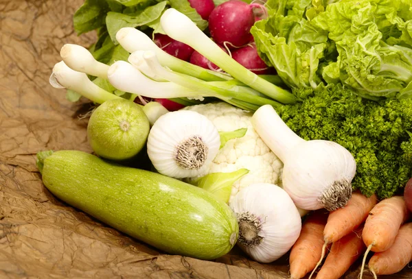 Fresh tasty vegetables on brown backgrou — Stock Photo, Image