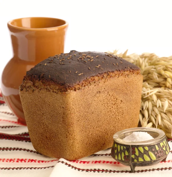 Delicious bread on folk background — Stock Photo, Image