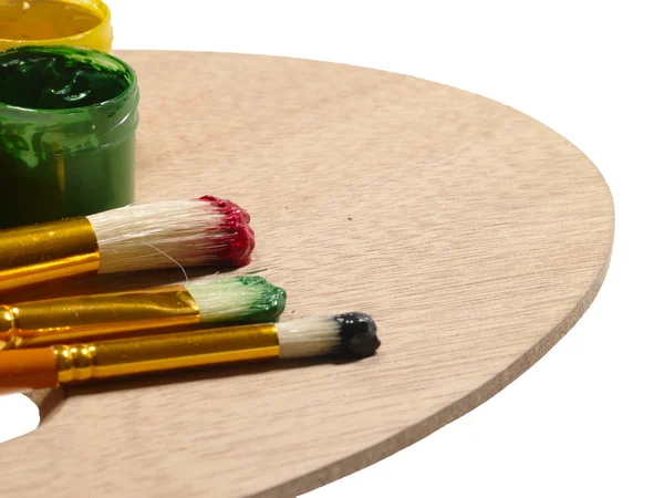 Paintbrushes on wooden palette. RGB conc — Stock Photo, Image