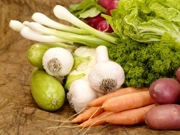 Fresh tasty vegetables on brown backgrou — Stock Photo, Image