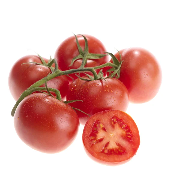 Färska smakrika tomater på vit bakgrund — Stockfoto