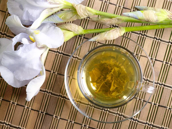 Cup of green tea with flower on bamboo b — Stock Photo, Image
