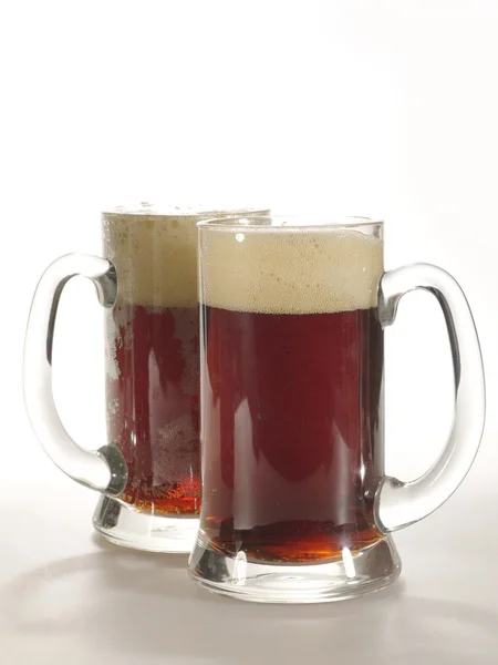Two ale mug with drink on the table — Stock Photo, Image