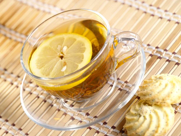 Tea with lemon fruit on bamboo backgroun — Stock Photo, Image