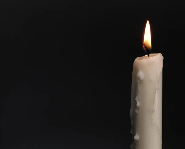 Burning candle over black. Is not isolat — Stock Photo, Image
