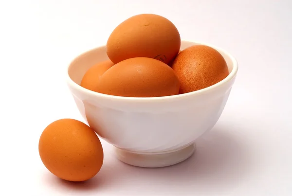 Eggs and cup — Stock Photo, Image