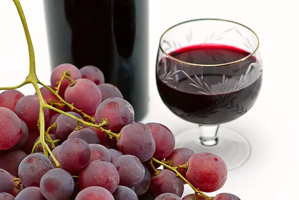 stock image Wine bottle and wineglass with grape