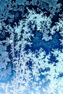 Frosty pattern on window glass clipart