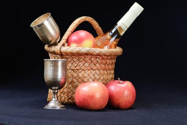 Apples, glass and bottle in the basket clipart