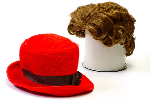 Red wig and red bonnet — Stock Photo, Image