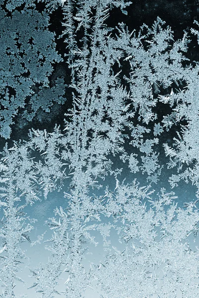 Frosty patroon op vensterglas Stockfoto