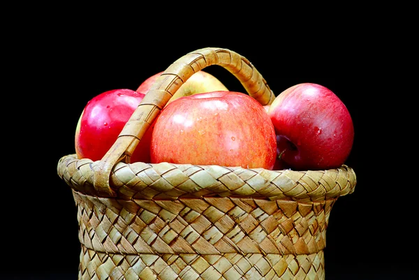 Apples in the basket on a black — Stock Photo, Image