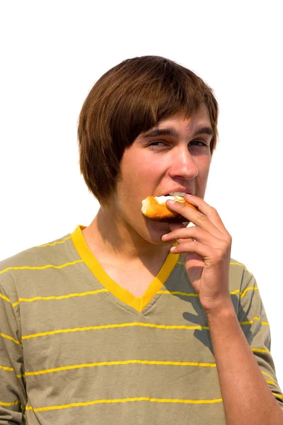 Guy eating curd tart — Stock Photo, Image