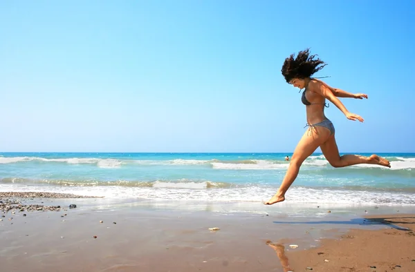 Jumping brunette girl — Stock Photo, Image
