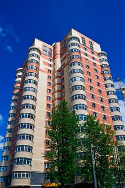 modern apartment buildings on sunny day. modern building against blue sky. 