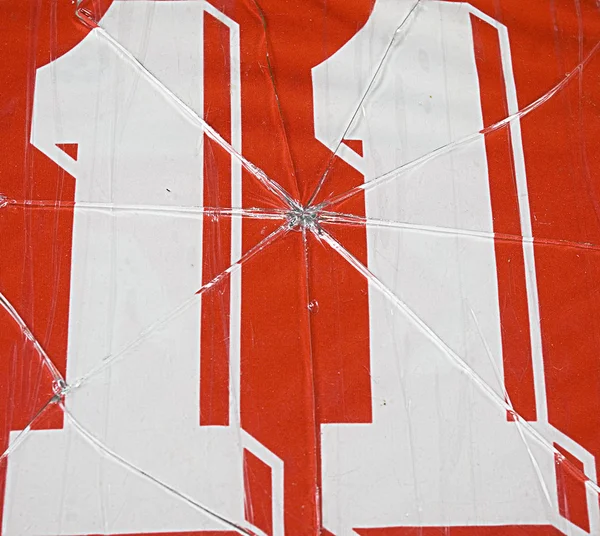 Número onze e vidro quebrado — Fotografia de Stock