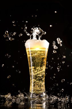 beer with bubbles and splash of water 