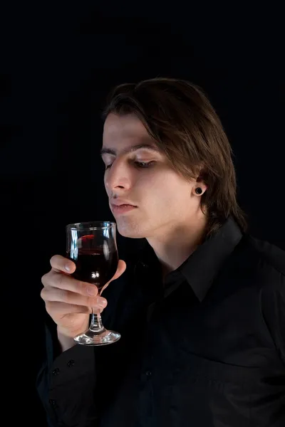 Handsome vampire with glass of wine or b — Stock Photo, Image