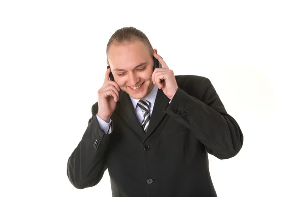 Homem de negócios sorrindo chamando em dois telefone — Fotografia de Stock