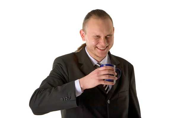 笑いのカップを持ったビジネスマン — ストック写真