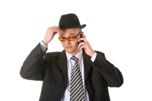 Сомнительный бизнесмен в шляпе и очках — стоковое фото