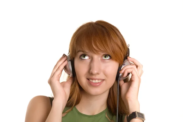 Chica sonriente en auriculares — Foto de Stock