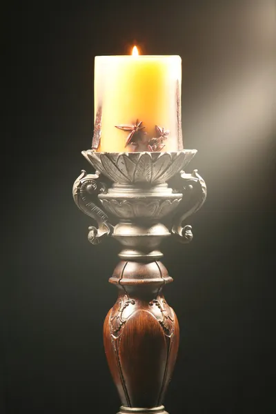 Antique wooden candlestick with ray of l — Stock Photo, Image