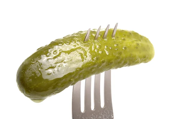 Salted cucumber on fork — Stock Photo, Image