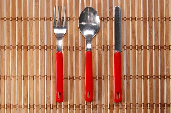 Red knife fork and spoon with paths — Stock Photo, Image