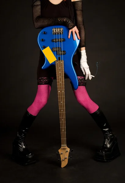 Close-up of girl with bass guitar and ci — Stock Photo, Image