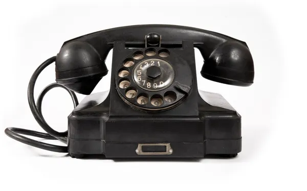 Oude zwarte telefoon met stof en krassen — Stockfoto
