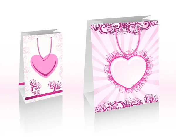 Sacos de compras roxas com corações — Fotografia de Stock