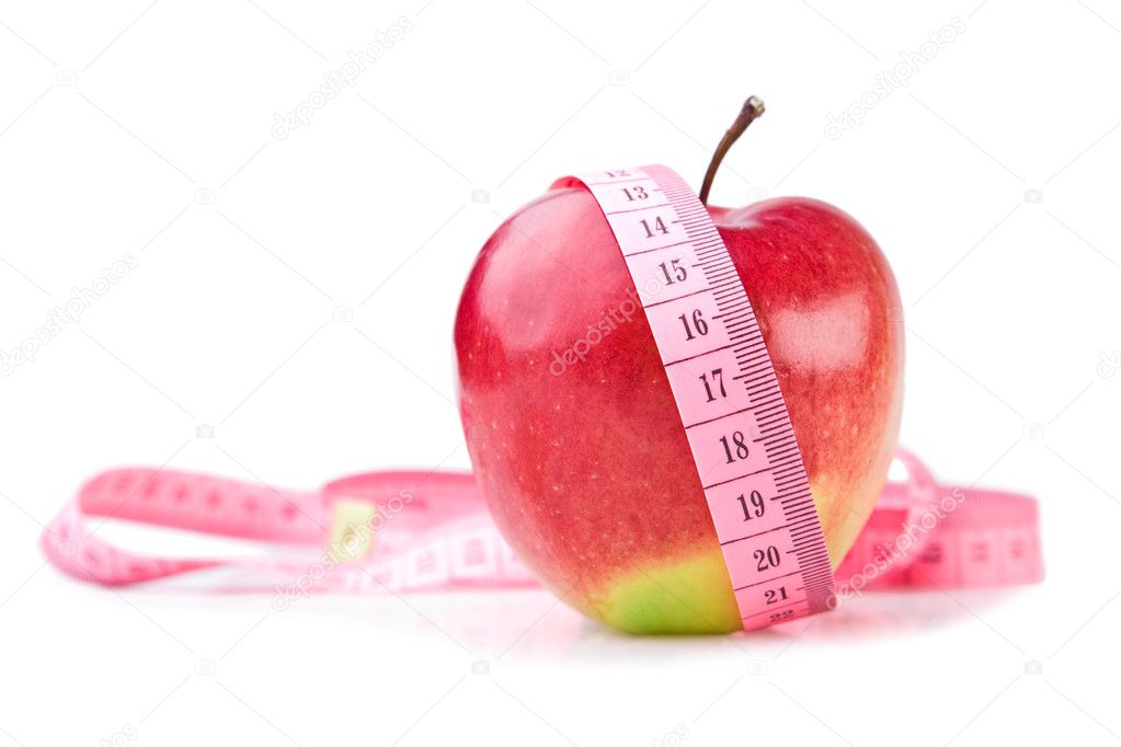 apple and measuring tape on white background 