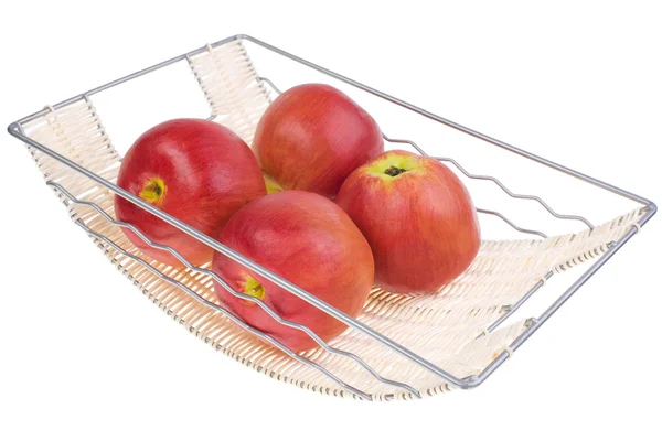 Jablko na pletené stánku — Stock fotografie