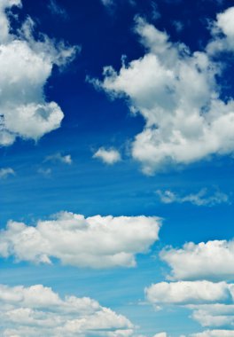 Blue sky with sparse clouds clipart