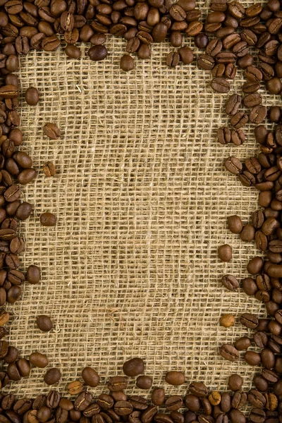Grains de café sur un sac — Photo